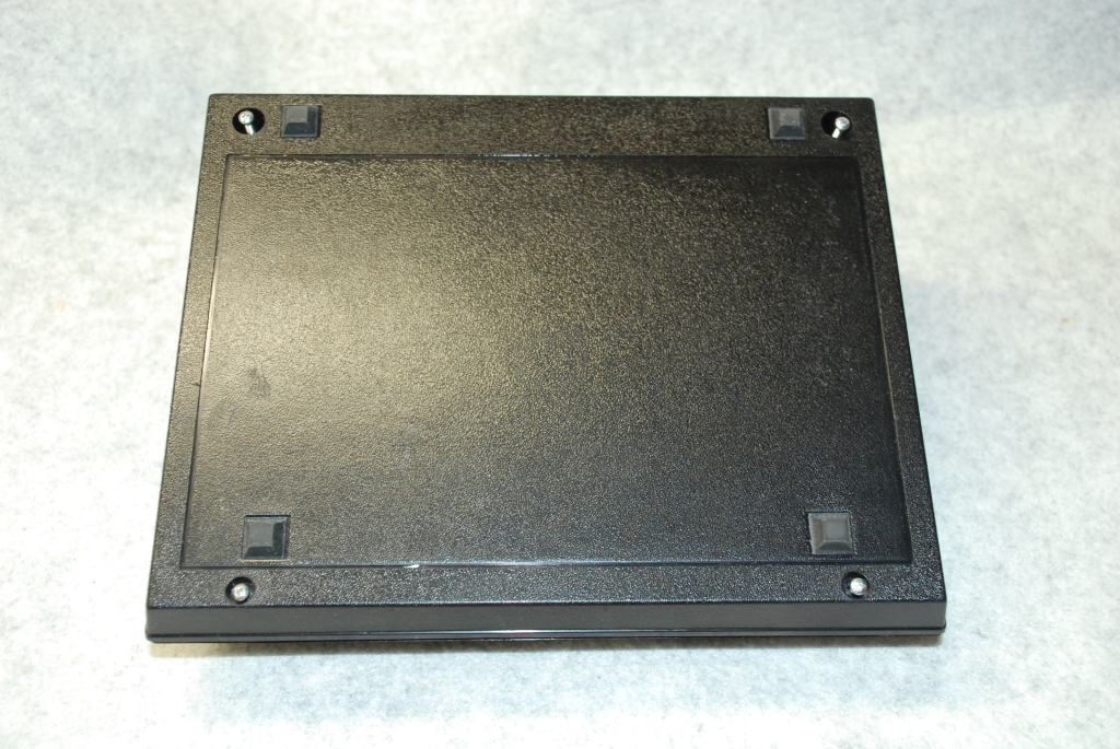 Removing the four case screws.