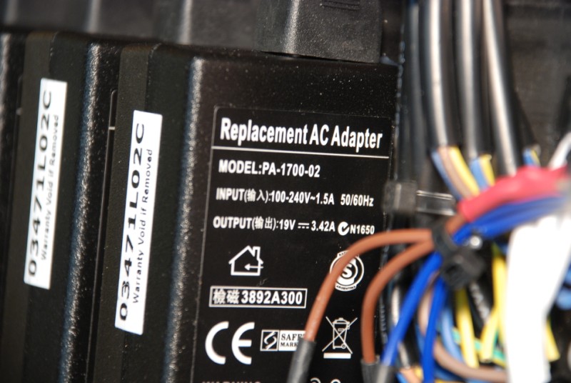 Close-up of one laptop power adapter.